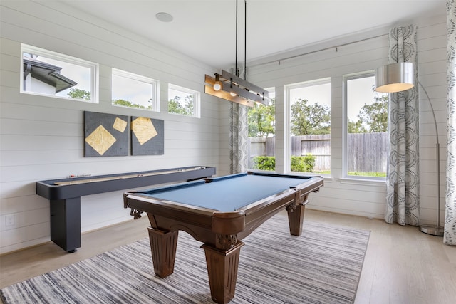 rec room with light hardwood / wood-style floors, pool table, and a wealth of natural light