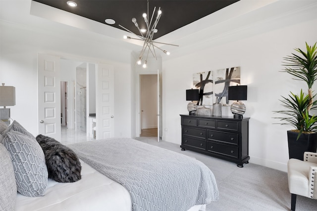 bedroom featuring a notable chandelier, light colored carpet, and a tray ceiling