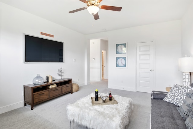 living room featuring carpet and ceiling fan