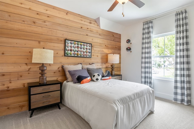 carpeted bedroom featuring multiple windows and ceiling fan