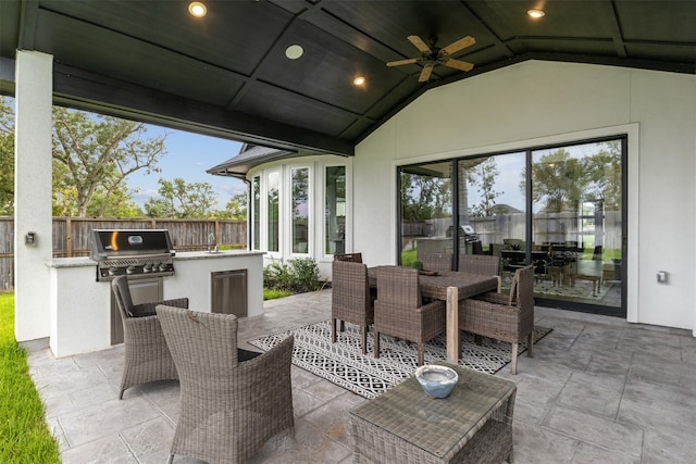 view of patio / terrace with ceiling fan, area for grilling, and an outdoor kitchen