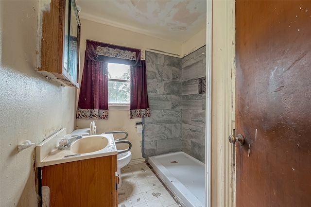 bathroom featuring tiled shower, tile patterned flooring, toilet, and vanity