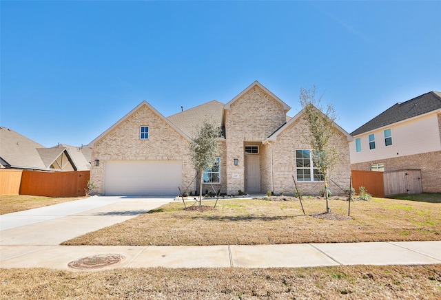 view of front of house with a garage and a front yard