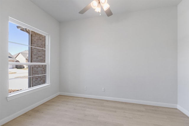 empty room with ceiling fan and light wood-type flooring