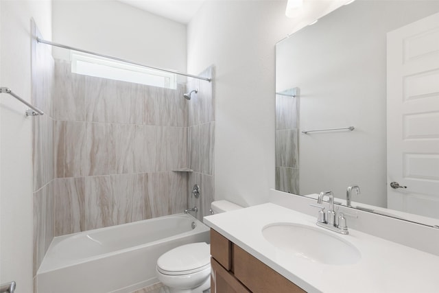 full bathroom with tiled shower / bath combo, vanity, and toilet