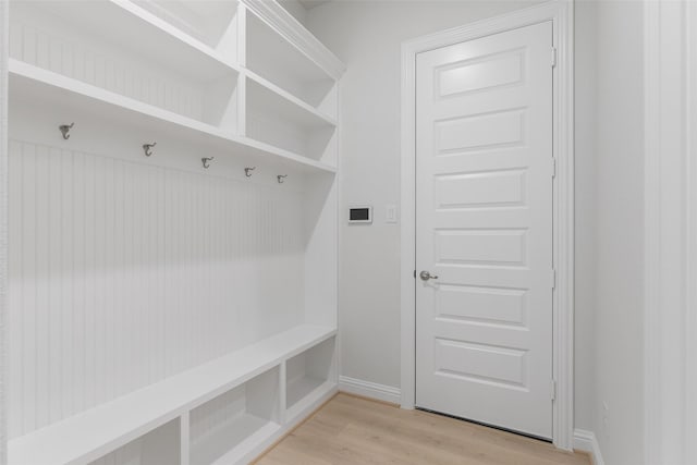 mudroom with light hardwood / wood-style floors