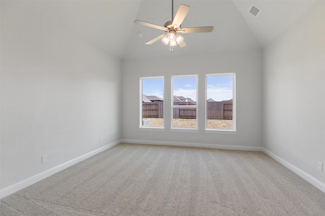 unfurnished room featuring ceiling fan, vaulted ceiling, and light carpet