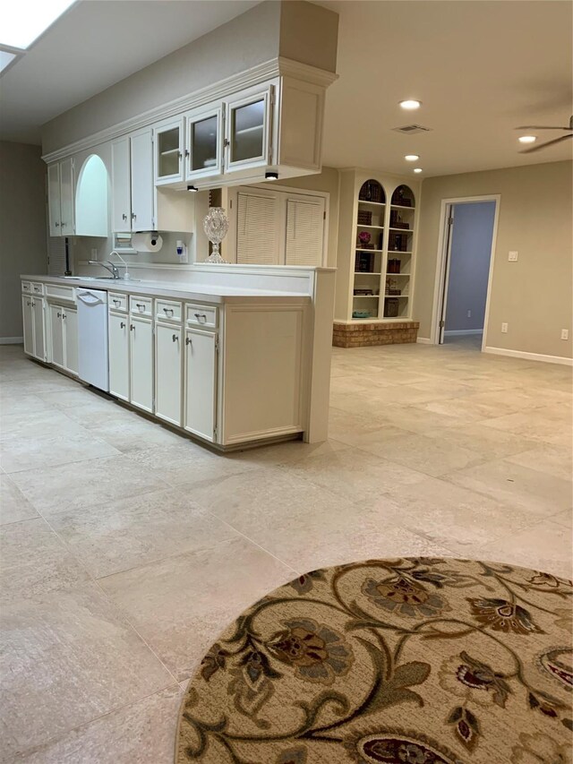 411 Sailfish St, Jones Creek, TX 77541 - kitchen featuring dishwasher, recessed lighting, glass insert cabinets, built in features, and light countertops
