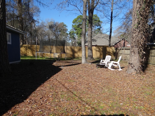 view of yard with a trampoline