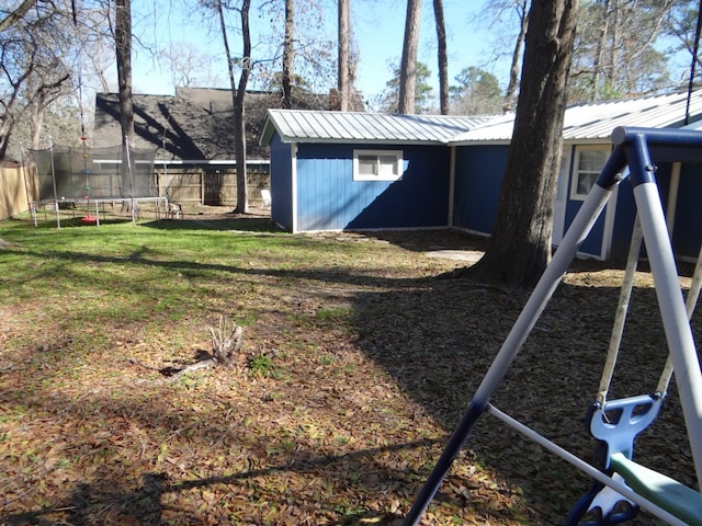 view of yard with a trampoline