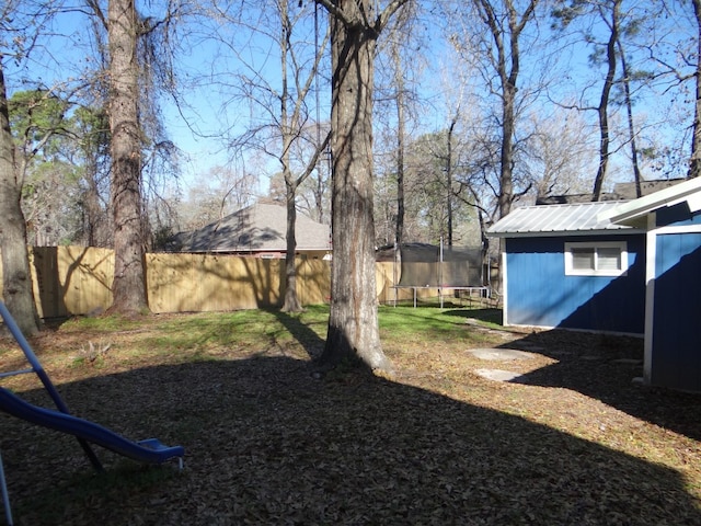 view of yard with a trampoline