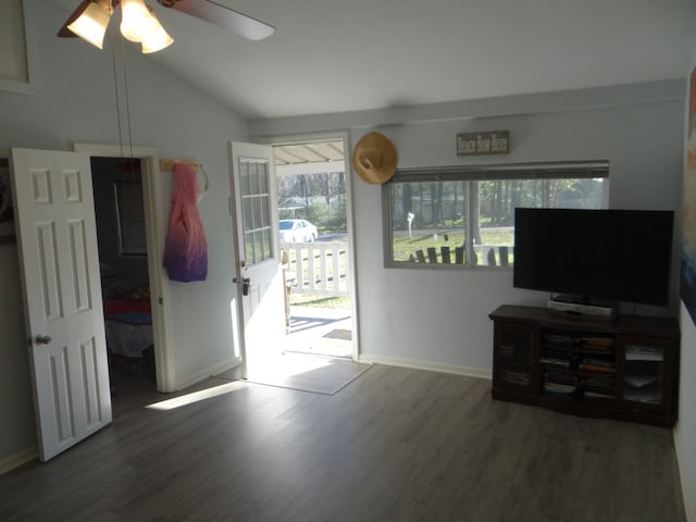 interior space with lofted ceiling, dark hardwood / wood-style floors, and ceiling fan