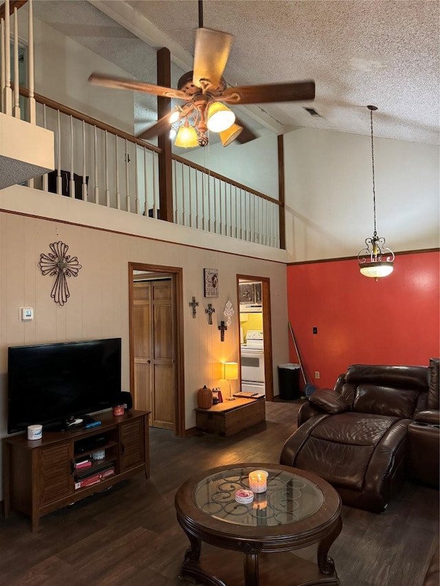 living room featuring a textured ceiling, high vaulted ceiling, ceiling fan, and dark hardwood / wood-style flooring