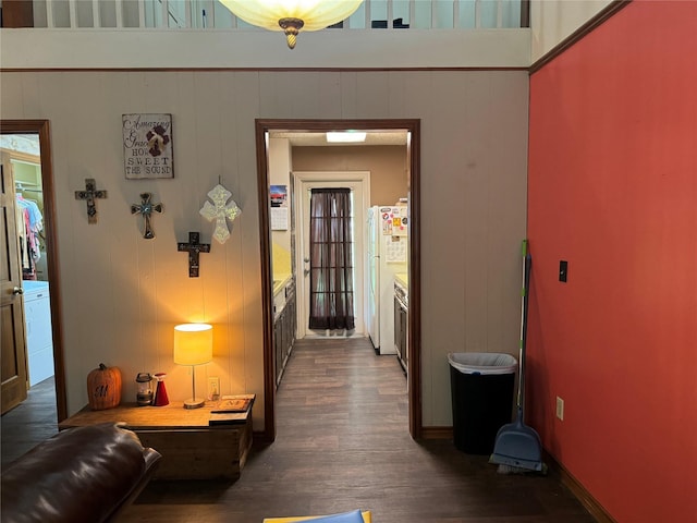 corridor with dark hardwood / wood-style floors