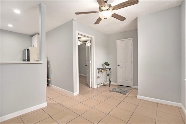 tiled foyer entrance with ceiling fan