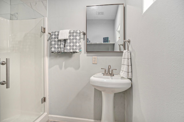 bathroom featuring an enclosed shower