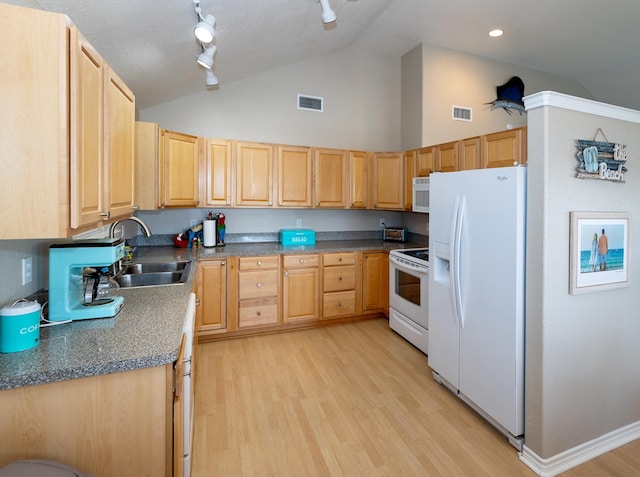 kitchen featuring track lighting, white appliances, sink, light hardwood / wood-style floors, and high vaulted ceiling