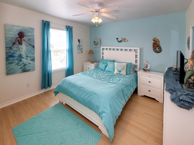 bedroom featuring ceiling fan and light hardwood / wood-style flooring