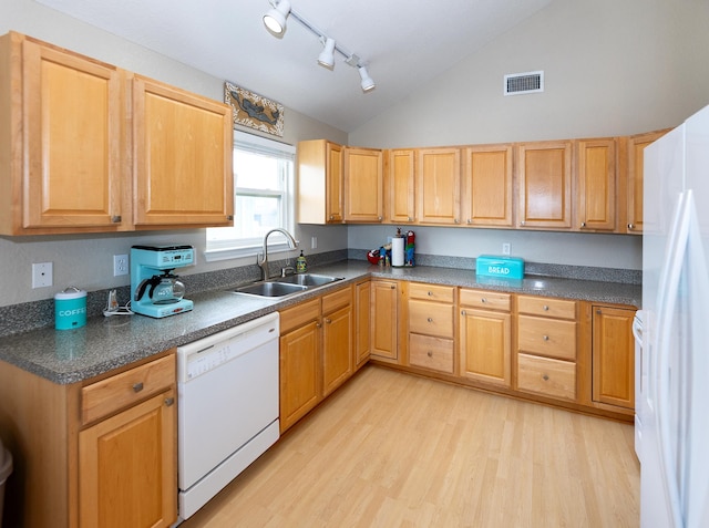 kitchen with white appliances, sink, vaulted ceiling, light hardwood / wood-style floors, and track lighting