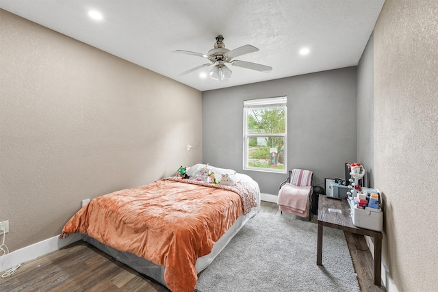 bedroom with wood-type flooring and ceiling fan