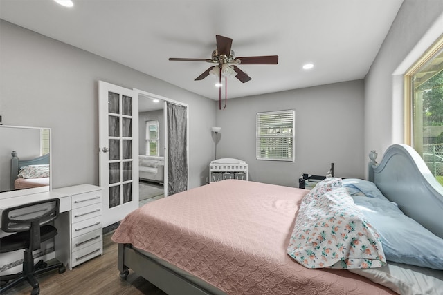 bedroom with ceiling fan and hardwood / wood-style flooring