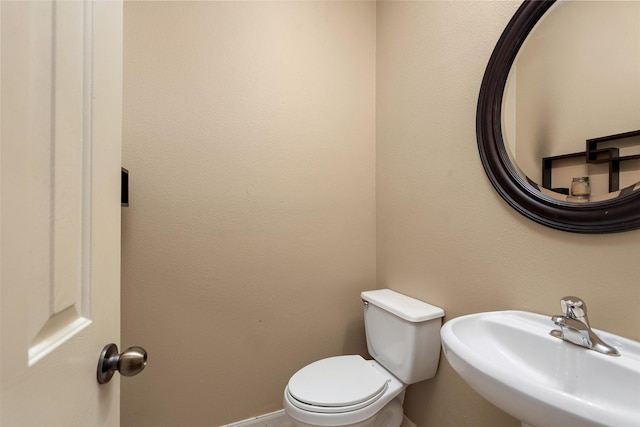 bathroom with sink and toilet