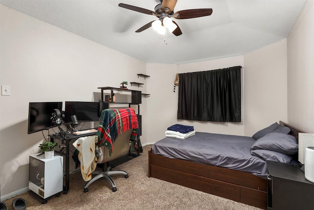 bedroom with ceiling fan and carpet