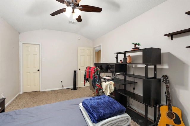 interior space featuring ceiling fan, vaulted ceiling, and carpet