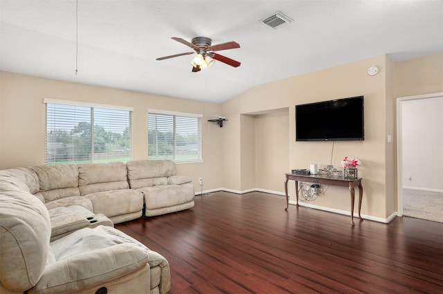 living room with dark wood-type flooring, ceiling fan, and vaulted ceiling