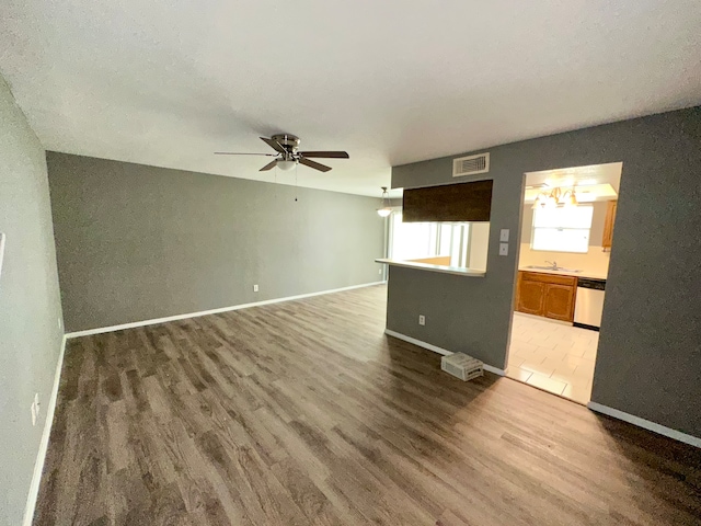 spare room with sink, ceiling fan, and tile patterned floors