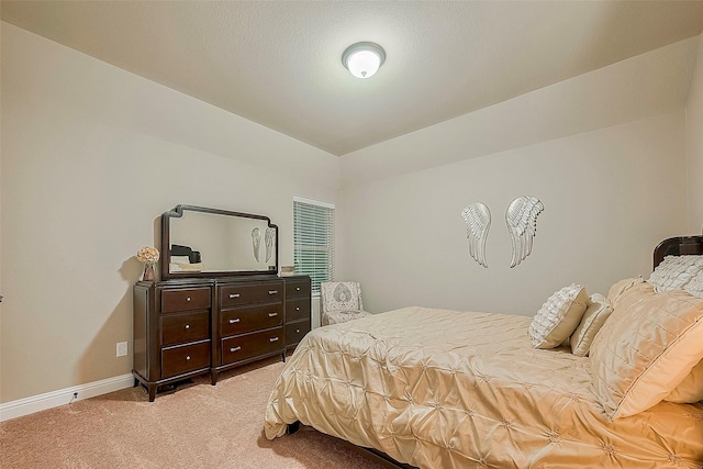 bedroom with light carpet