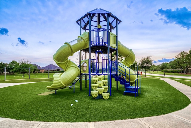 playground at dusk with a lawn