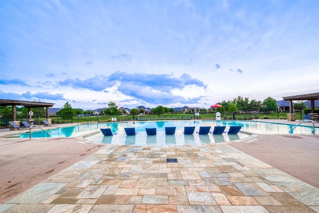 view of swimming pool with a pergola