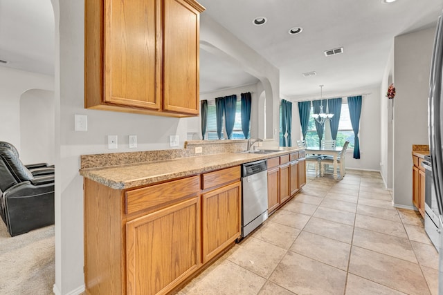 kitchen featuring hanging light fixtures, sink, light tile patterned flooring, stainless steel dishwasher, and a chandelier