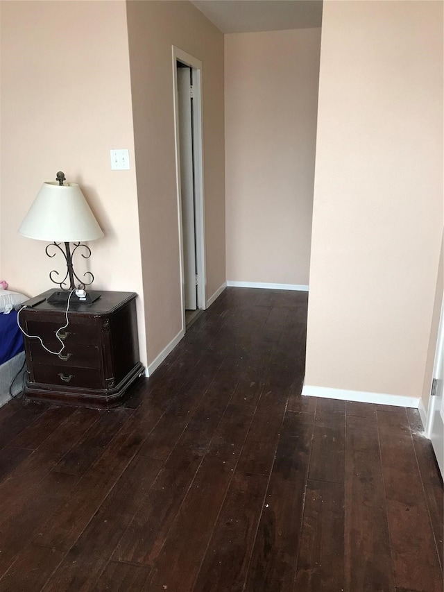 hall with dark hardwood / wood-style floors