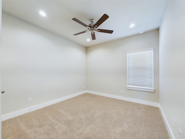 empty room with ceiling fan and carpet flooring