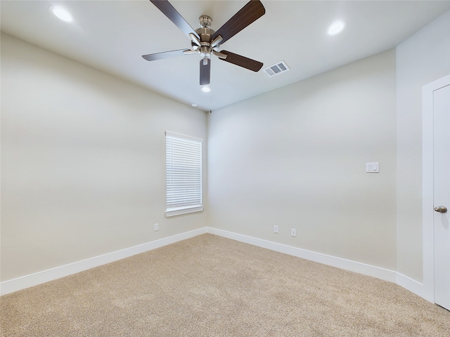 carpeted empty room featuring ceiling fan