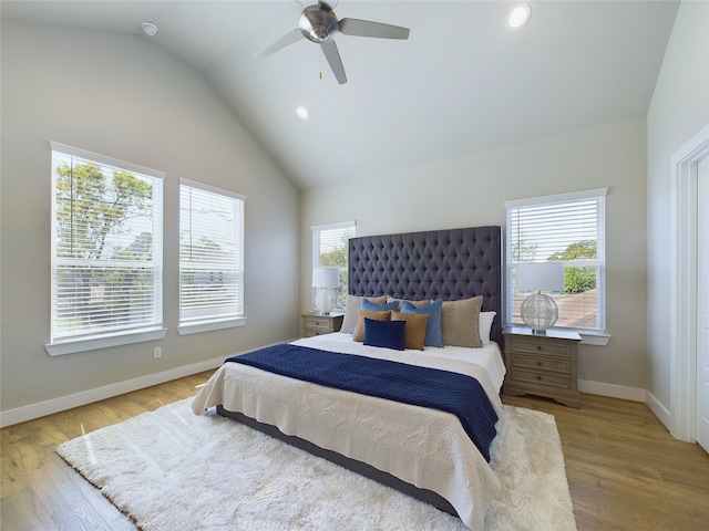 bedroom with light hardwood / wood-style flooring, lofted ceiling, and ceiling fan