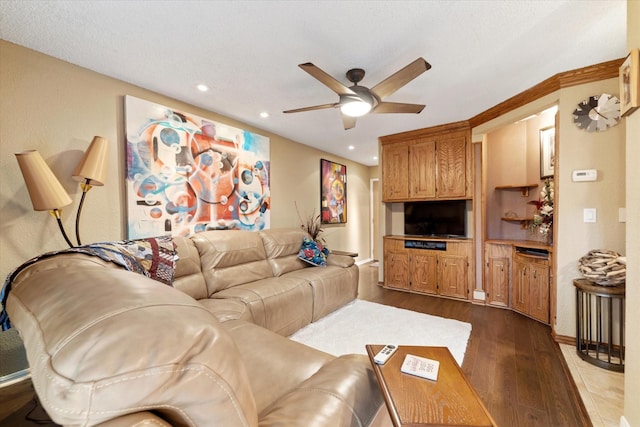 living room with light wood-type flooring and ceiling fan