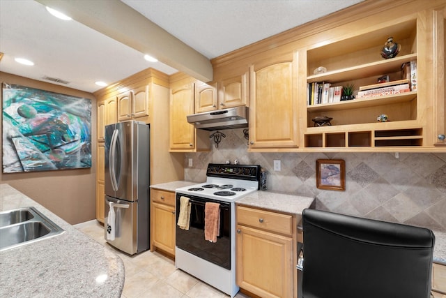 kitchen featuring light brown cabinets, stainless steel fridge, backsplash, light tile patterned flooring, and white electric stove