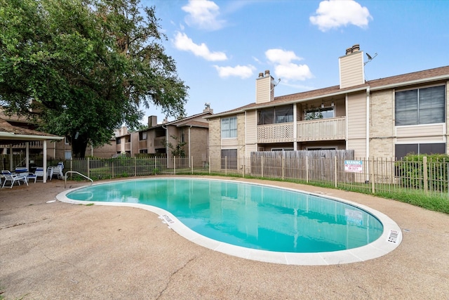 view of swimming pool featuring a patio