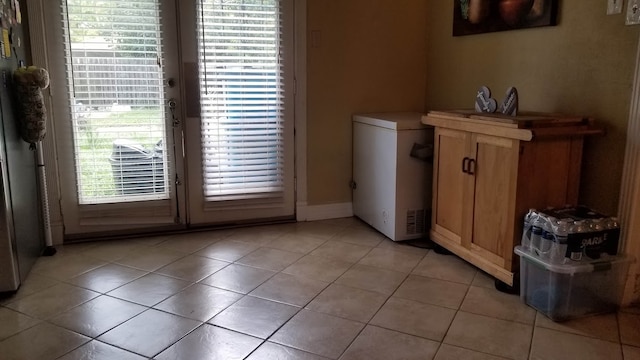 interior space with light tile patterned floors