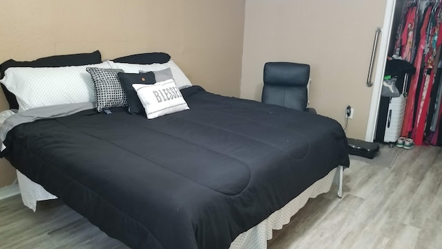 bedroom with light wood-type flooring