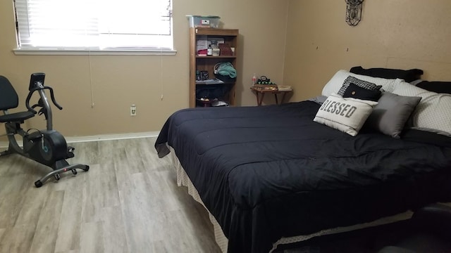 bedroom with light hardwood / wood-style floors