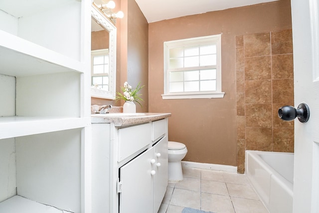 full bathroom with tile patterned floors, toilet, vanity, and tiled shower / bath