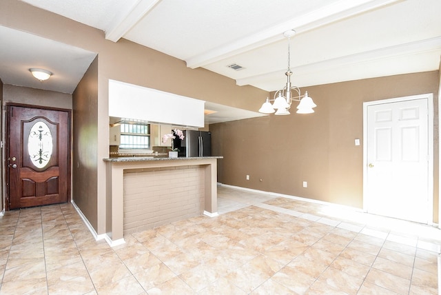 tiled entryway featuring beamed ceiling and a notable chandelier