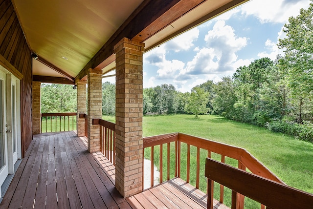 wooden terrace with a yard