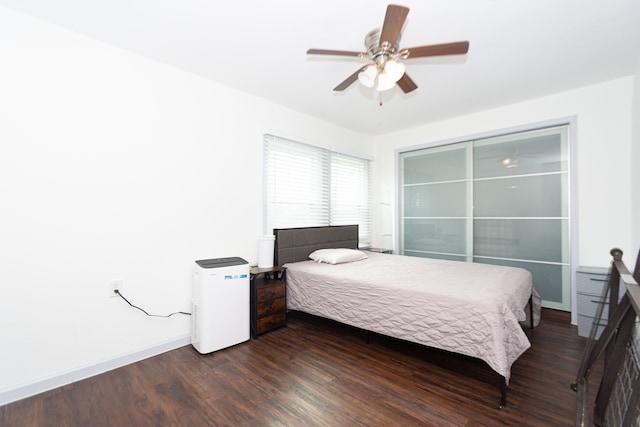 bedroom with hardwood / wood-style flooring and ceiling fan