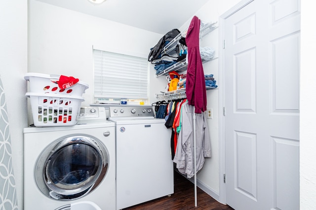 laundry room featuring dark wood-type flooring and washer and clothes dryer