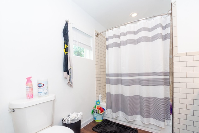 4606 Sharon St, Houston, TX 77020 - bathroom featuring toilet and shower / tub combo with curtain